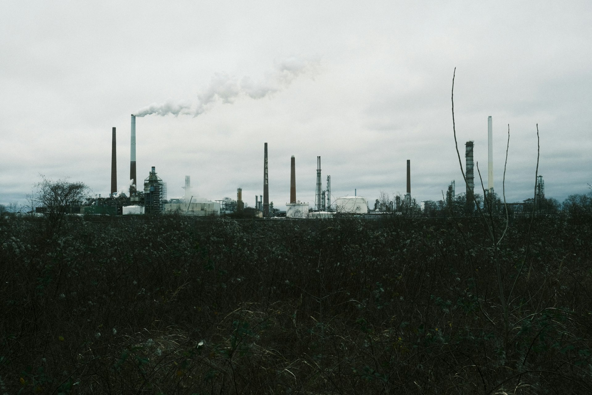 a factory with smoke coming out of it's stacks