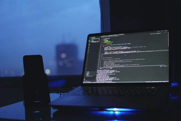 a laptop computer sitting on top of a desk
